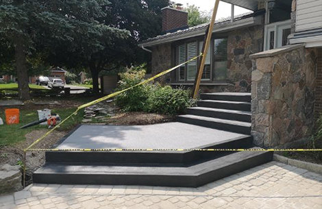 Concrete front steps that have been recently poured